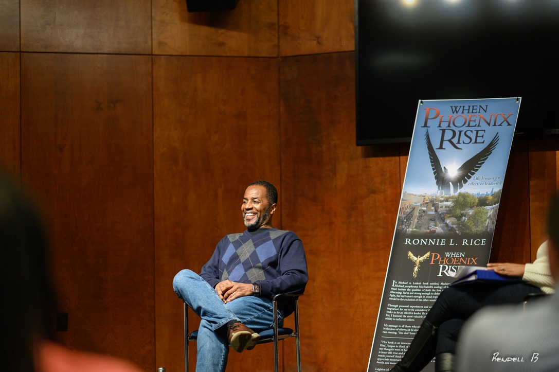 Ronnie L. Rice smiles during a discussion about his book
